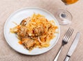 Delicious pork ribs stewed in gravy with sauerkraut close up Royalty Free Stock Photo