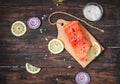 Delicious portion of fresh salmon fillet with aromatic herbs, spices and vegetables - healthy food, diet or cooking concept Royalty Free Stock Photo