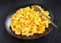 Hot Mac and Cheese on black plate Royalty Free Stock Photo