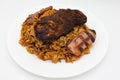 Jambalaya with Blackened Chicken and Andouille Sausage with Seasoned Rice on a White Plate