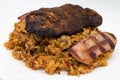 Jambalaya with Blackened Chicken and Andouille Sausage with Seasoned Rice on a White Plate