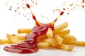 Delicious potato fries falling into splashing tomato ketchup, cut out. Close up of falling down fries with splash ketchup in