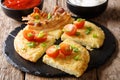 Delicious potato pancakes with bacon, tomatoes, onions and sauce Royalty Free Stock Photo