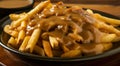 Delicious poutine with gravy and cheese curds on a plate