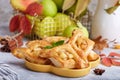 Delicious puff pastries with apples, plums and cinnamon