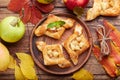 Delicious puff pastries with apples, plums and cinnamon