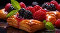Delicious puff pastries with berries on baking sheet.
