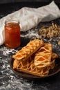 delicious puff pastry with apricot jam on the background Royalty Free Stock Photo