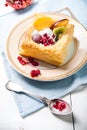 Delicious puff pastry with cream and fruits