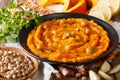 Delicious pumpkin hummus with ingredients close up. horizontal Royalty Free Stock Photo