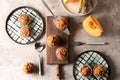 Delicious pumpkin muffins with sunflower seeds on table Royalty Free Stock Photo