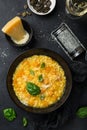 Delicious pumpkin risotto, black background