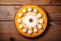 Delicious pumpkin tart with whipped cream, top view