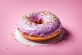 Delicious purple donut topped with colorful sprinkles on vibrant pink background. For advertise cafe, pastry shop Royalty Free Stock Photo