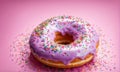 Delicious purple donut topped with colorful sprinkles on vibrant pink background. For advertise cafe, pastry shop Royalty Free Stock Photo