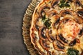 Delicious quiche with mushrooms on dark grey table, top view Royalty Free Stock Photo