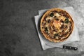 Delicious quiche with mushrooms and knife on dark table, flat lay. Space for text Royalty Free Stock Photo