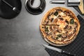 Delicious quiche with mushrooms served on dark grey table, flat lay. Space for text Royalty Free Stock Photo