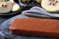 Delicious quince paste on board, closeup view