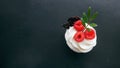 Delicious raspberry cupcakes on dark background