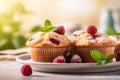 Delicious raspberry muffins on blurred kitchen background with text space for creative placement. Royalty Free Stock Photo