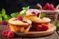 Delicious raspberry muffins with copy space on blurred background for easy recipe concept