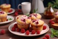 Delicious raspberry muffins dessert concept in cozy home kitchen with copy space for text Royalty Free Stock Photo