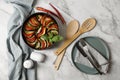 Delicious ratatouille, chili peppers and cutlery on white marble table, flat lay Royalty Free Stock Photo