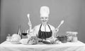 Delicious recipe concept. Gourmet main dish recipes. Cooking is her hobby. Cooking healthy food. Girl in hat and apron Royalty Free Stock Photo