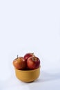 Delicious red apples on the table with side view on white background