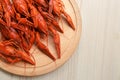 Delicious red boiled crayfish on white wooden table, top view Royalty Free Stock Photo