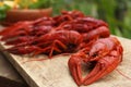 Delicious red boiled crayfish on wooden table, closeup Royalty Free Stock Photo