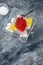 Delicious red caviar in bowl, Close-up salmon caviar. Delicatessen. Gourmet food. Seafood. appetizer, selective focus, place for Royalty Free Stock Photo