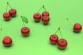 Delicious red cherries on green background Royalty Free Stock Photo