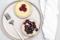 Delicious red raspberry strawberry, blueberry whipped creamy tartlets,cakes.gourmet confection dessert on plate with Royalty Free Stock Photo