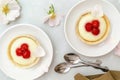 Delicious red raspberry strawberry whipped creamy tartlets,cakes.gourmet confection dessert on plate with latte coffee Royalty Free Stock Photo