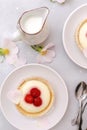 Delicious red raspberry strawberry whipped creamy tartlets,cakes.gourmet confection dessert on plate with latte coffee,milk.sweet Royalty Free Stock Photo