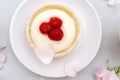 Delicious red raspberry strawberry whipped creamy tartlets,cakes.gourmet confection dessert on plate with latte coffee Royalty Free Stock Photo