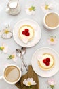 Delicious red raspberry strawberry whipped creamy tartlets,cakes.gourmet confection dessert on plate with latte coffee Royalty Free Stock Photo