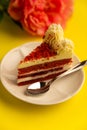 Delicious red velvet cake on top of yellow table