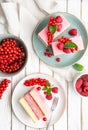 Delicious and refreshing juicy dessert, punch cake topped with sugar icing and fresh raspberries and red currants