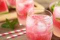 Delicious refreshing watermelon drink on table, closeup