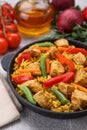 Delicious rice and chicken served with vegetables on light grey table Royalty Free Stock Photo