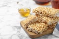 Delicious rice crispy treats on white marble table. Space for text Royalty Free Stock Photo