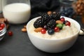 Delicious rice pudding with berries on table, closeup Royalty Free Stock Photo