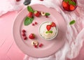 Delicious rice pudding with berries in bowl on color plate Royalty Free Stock Photo