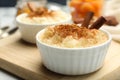 Delicious rice pudding with cinnamon on board, closeup Royalty Free Stock Photo
