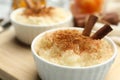 Delicious rice pudding with cinnamon on board, closeup Royalty Free Stock Photo