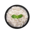 Delicious rice pudding with mint in bowl on white background Royalty Free Stock Photo