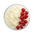 Delicious rice pudding with redcurrant isolated on white, top view